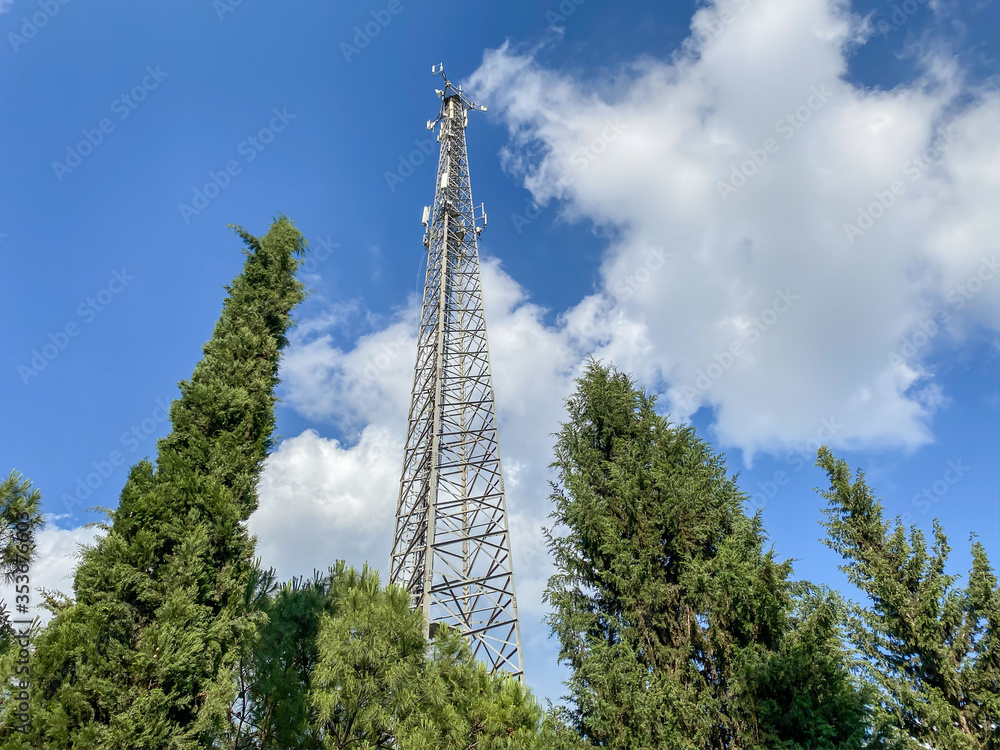 Cellular Base Station or Base Transceiver Station. Telecommunication tower. Wireless Communication Antenna Transmitter. 3G, 4G and 5G Cell Site with blue and cloudy sky. Cellular Base Station or Base Transceiver Station. Telecommunication tower. Wireless Communication Antenna Transmitter. 3G, 4G and 5G Cell Site with blue and cloudy sky.