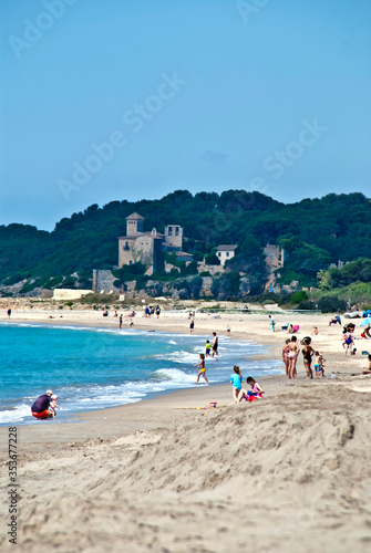 Playa de Creixell, Tarragona (España) con castillo al fondo photo