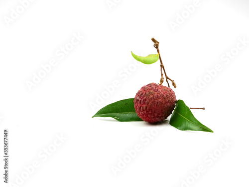 Lychee fruit and green leaves. Isolated on a white background.