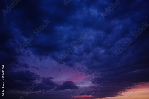 Colorful sunset. Blue, pink and red colors. Dark look.