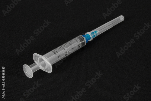 Syringe for injection on a dark background