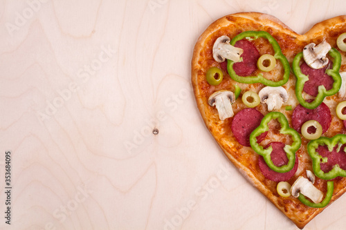 Fototapeta Naklejka Na Ścianę i Meble -  pizza, heart pizza, Valentine's day pizza, top view