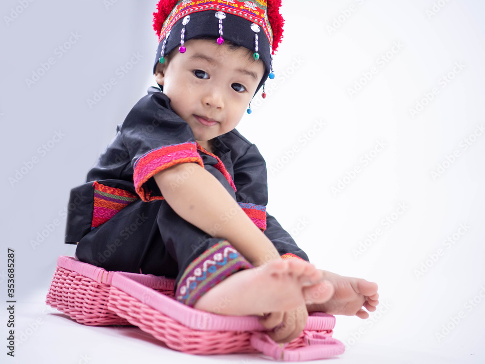 Hmong children little boy wearing traditional dress on white background Hmong children little boy wearing traditional dress on white background