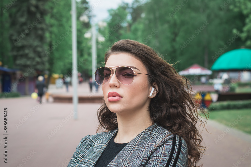 Portrait of a Stylish Pretty Young Woman outdoor