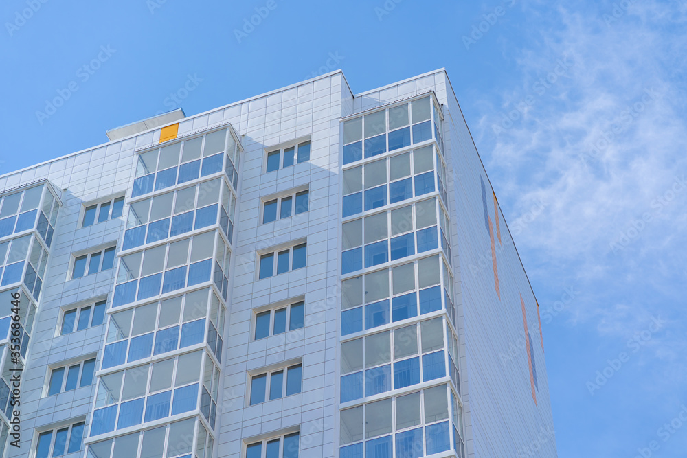 Modern apartment buildings on a sunny day with a blue sky. Facade of a modern apartment building. residential building modern apartment condominium architecture