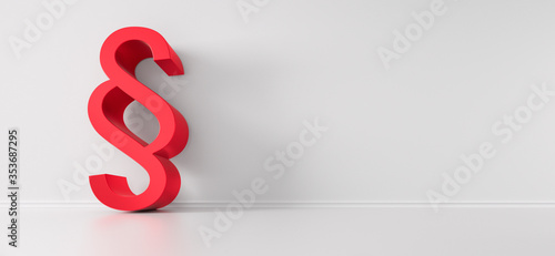 Red Paragraph Symbol leaning against white Wall with Copy Space