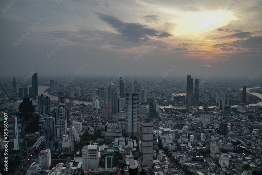 panoramic skyline of Bangkok at sunset from King Power Mahanakhon, Bangkok, Thailand