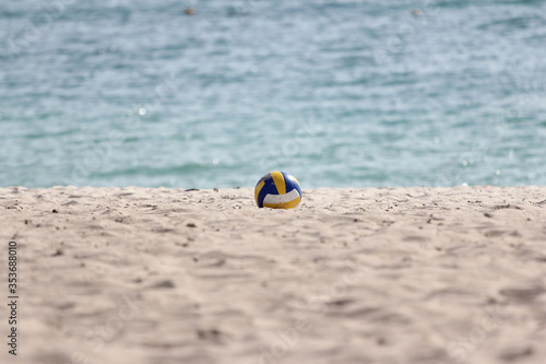 The volleyball on sand beach have sea background at thailand