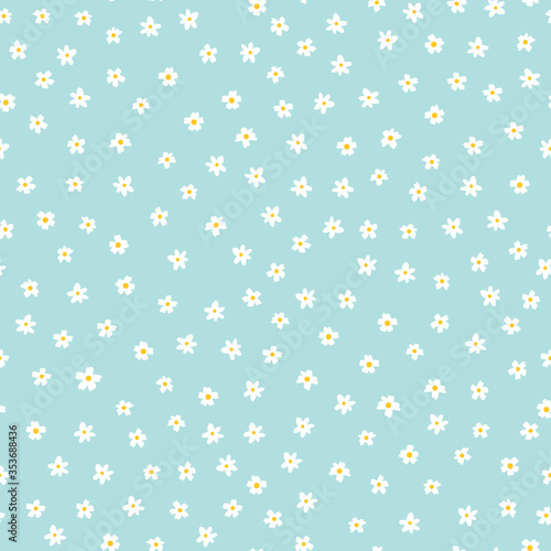 White ditsy flowers on blue seamless vector pattern. Floral background with small white flowers. Liberty style. Floral repeating texture for fashion prints. Ditsy print. Spring, summer decor