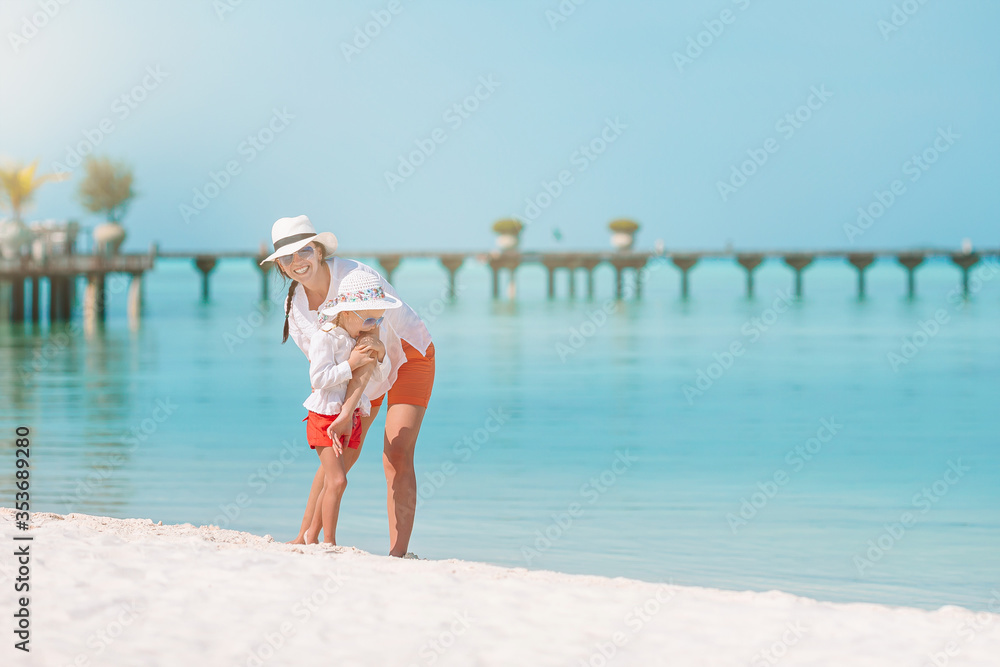 Mom with little daughter on the beach. Mom with little daughter on the beach.