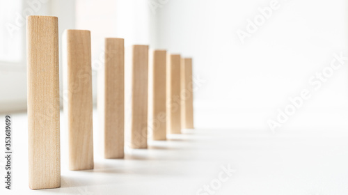 wooden blocks stand vertically one after another