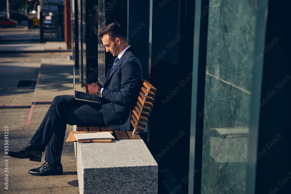 Handsome Caucasian man spending time outside alone Handsome Caucasian man spending time outside alone
