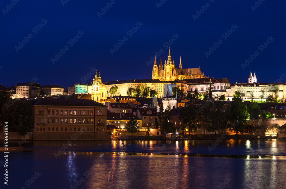 View of Prague old town, historical center with Prague Castle, St. Vitus Cathedral in Hradcany district, Charles Bridge Karluv Most, Vltava river, night twilight evening view, Bohemia, Czech Republic View of Prague old town, historical center with Prague Castle, St. Vitus Cathedral in Hradcany district, Charles Bridge Karluv Most, Vltava river, night twilight evening view, Bohemia, Czech Republic