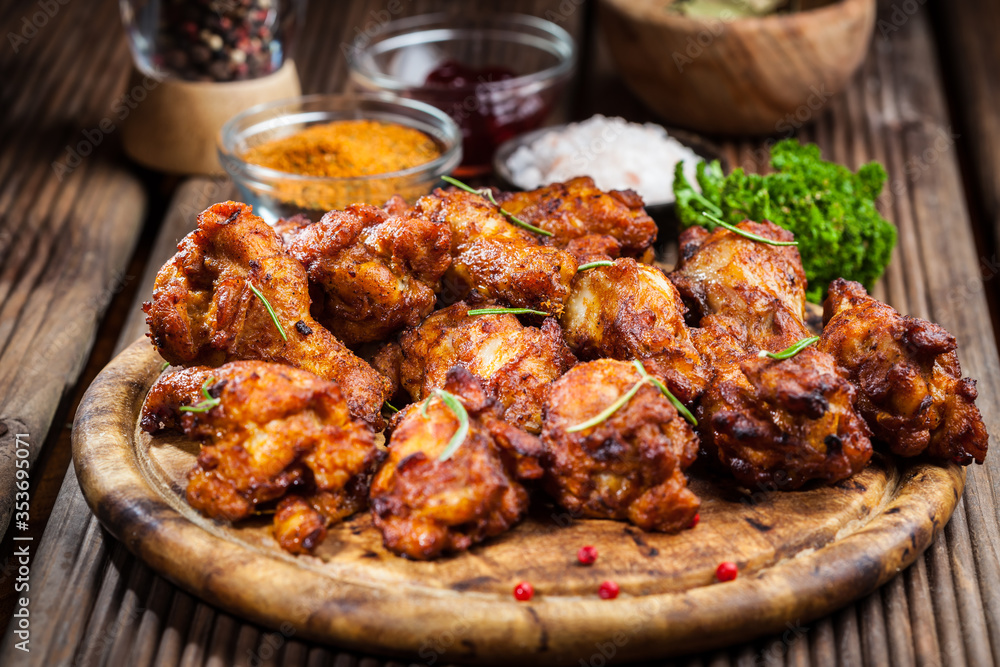 Hot chicken wings with different spices and dips
