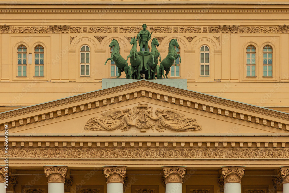 Fototapeta premium Statue of Apollo managing a cart of horses harnessed to a chariot on the roof of the Bolshoi Theater in Moscow