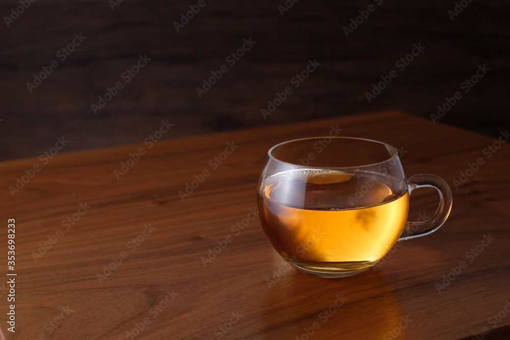 Glass cup of orange black tea Glass cup of orange black tea