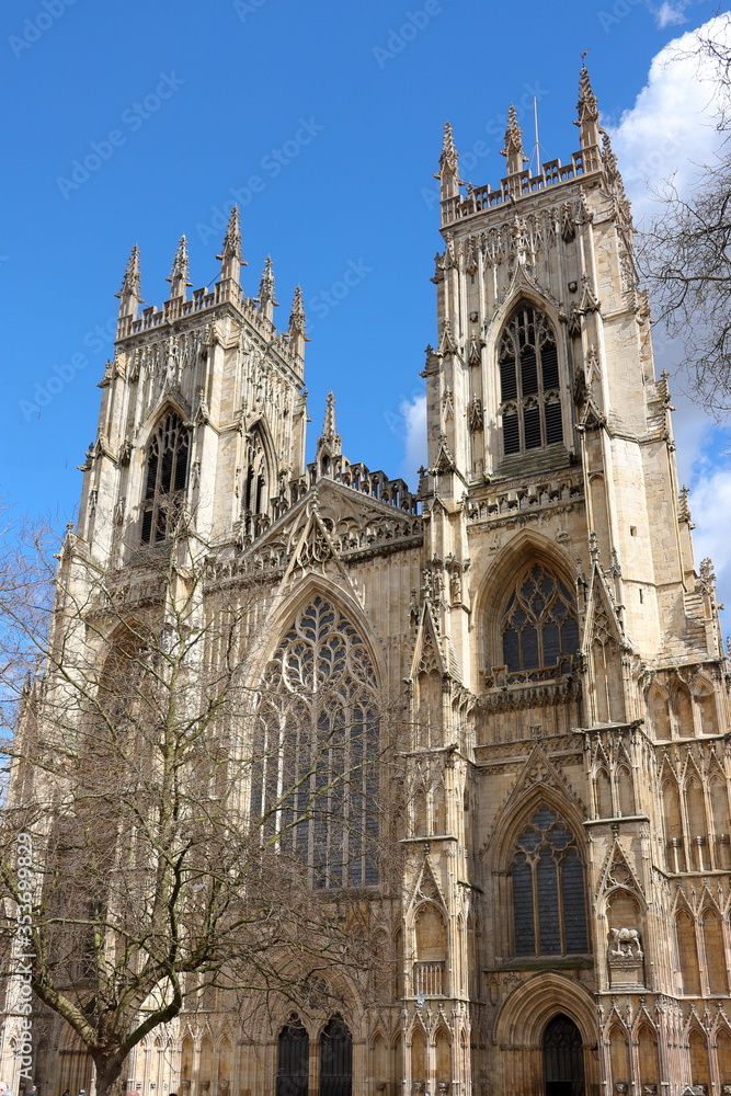 A sunny, spring afternoon view of the facade of stunning York Minster, York, UK