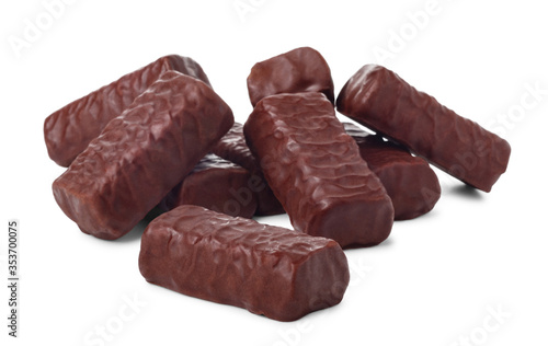 Pile of chocolate candies isolated on white background, small depth of focus.
