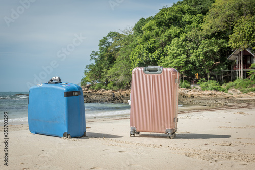 two suitcases on the beach at the island Koh Samet