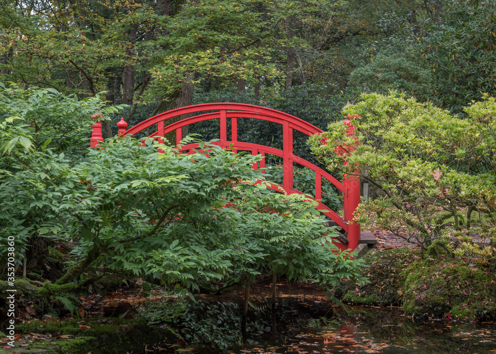 red bridge at the Japanese garden in the Hague red bridge at the Japanese garden in the Hague