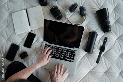 top view of creative photographer using graphic tablet on work table.