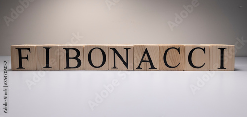 Business concept of fibonacci text with wooden cubes. close op.