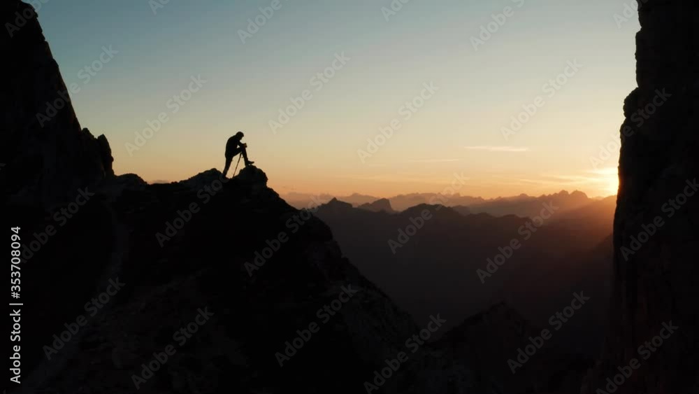 silhouette of a man on the top of the mountain silhouette of a man on the top of the mountain