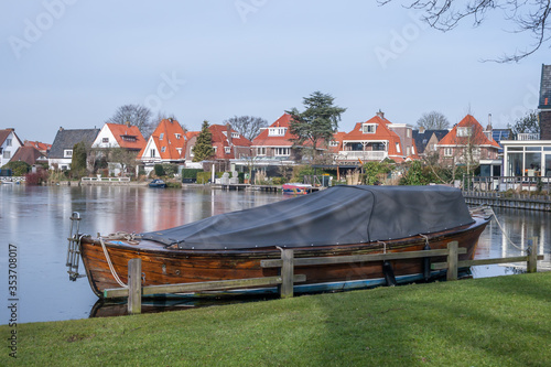 wooden boat on a frozen lake