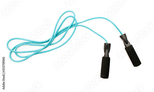 Blue skipping rope or jump rope isolated on white background, top view photo