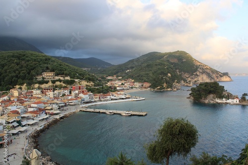 Panorama of Parga town and harbor in Preveza in Epirus, Greece in a cloudy day at winter. Parga lies on the Ionian coast between the cities of Preveza and Igoumenitsa