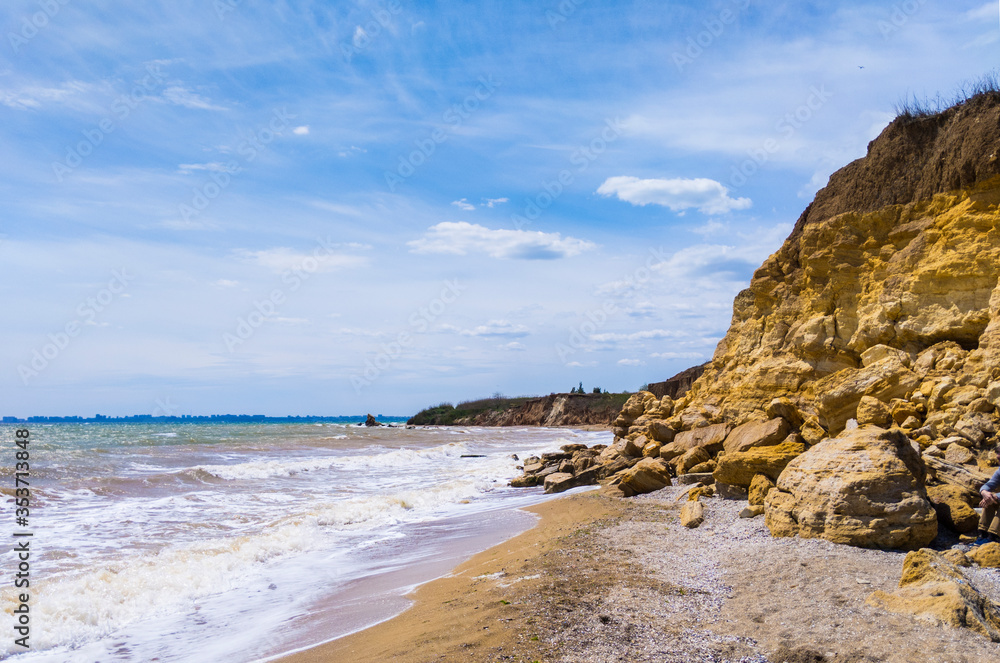 Relaxing seascape with wide horizon of the cloudy sky, rocks and the sea. Relaxing seascape with wide horizon of the cloudy sky, rocks and the sea.