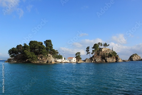The islet of Panagia and Panagia orthodox chapel in Parga town in regional unit of Preveza in Epirus, Greece. Parga lies on the Ionian coast in Mediterranean sea