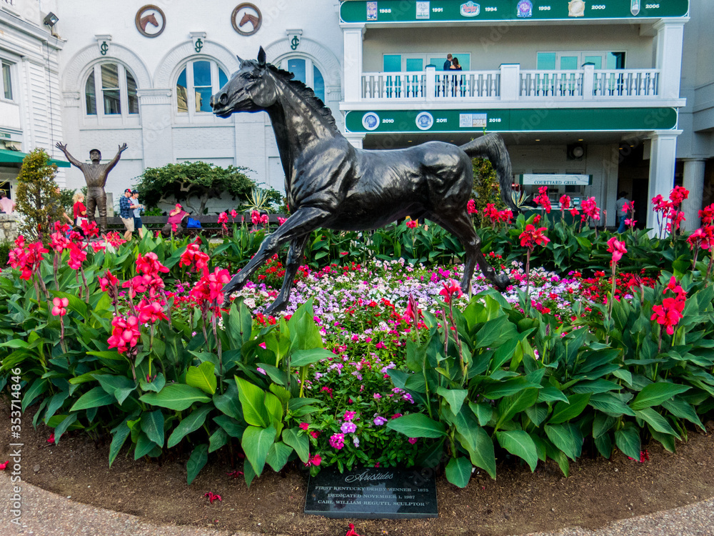 The statue of Aristides surrounded by flowers in the paddock at