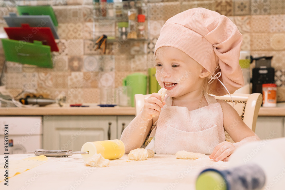 Little girl cooks at home in the kitchen Little girl cooks at home in the kitchen