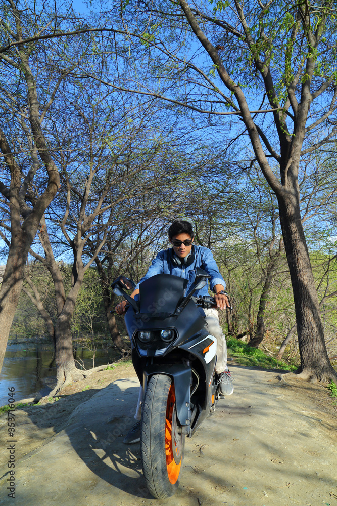 Stylish male model with motorcycle or sports bike Stylish male model with motorcycle or sports bike