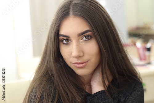 Beautiful young caucasian woman wearing dark shirt posing for a portrait. Fashion. Style. natural makeup. No makeup. natural beauty. horizontal