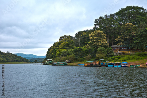 Thekkady, Kerala/India - September 24, 2013: The double-decker passenger boat that was capsized in the boat disaster occurred on 30 September 2009, was kept on shore along with other tourist boats.