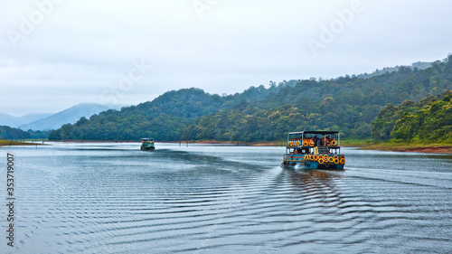 Photography Thekkady, Kerala/India - September 24, 2013: Tourists on board Kerala Tourism Development Corporation (KTDC) jetty, doing sightseeing at Periyar National Park and Wildlife Sanctuary