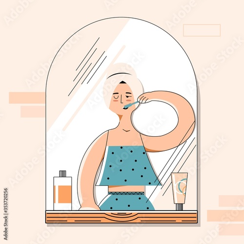 Girl brushes her teeth in the bathroom with a towel on her head and looks in the mirror. Vector flat illustration
