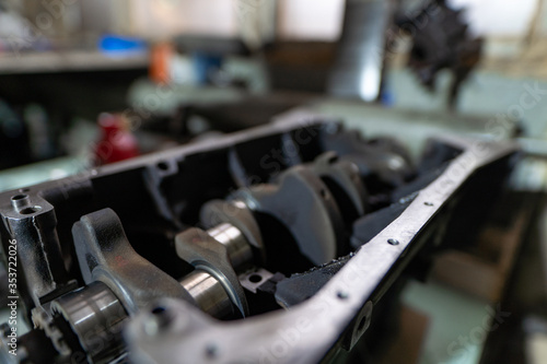 Disassembled crankshaft. Disassembled engine during repair.