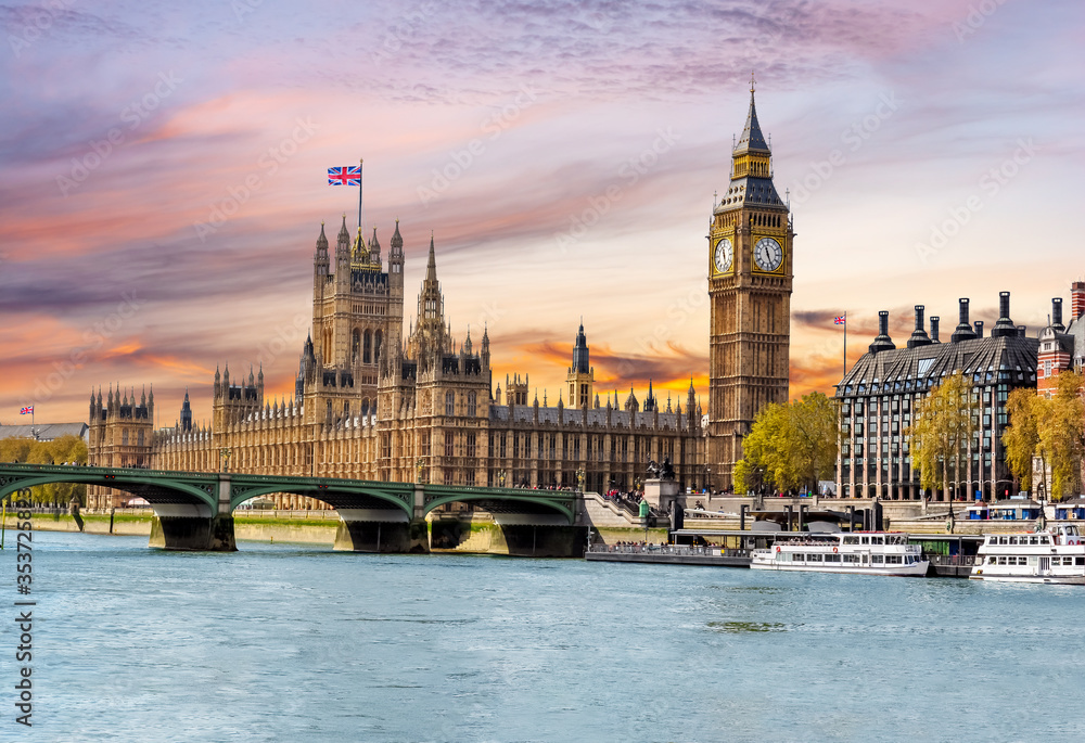 Houses of Parliament with Big Ben and Westminster bridge at sunset, London, UK