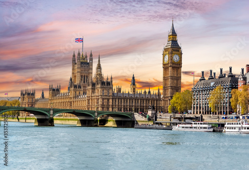 Houses of Parliament with Big Ben and Westminster bridge at sunset, London, UK