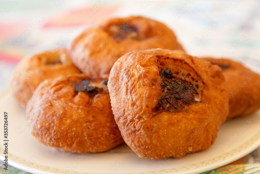 Close-up of Tatar deep-fried patties belyashi with meat and onions. Close-up of Tatar deep-fried patties belyashi with meat and onions.