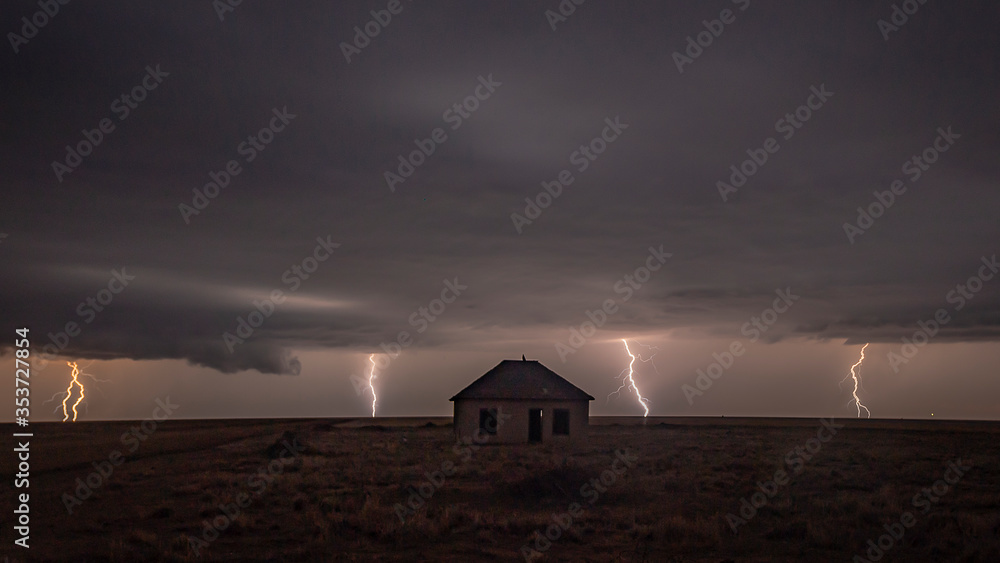Dramatic Lightning Storm Over an Abandoned Building on the Great Plains Dramatic Lightning Storm Over an Abandoned Building on the Great Plains