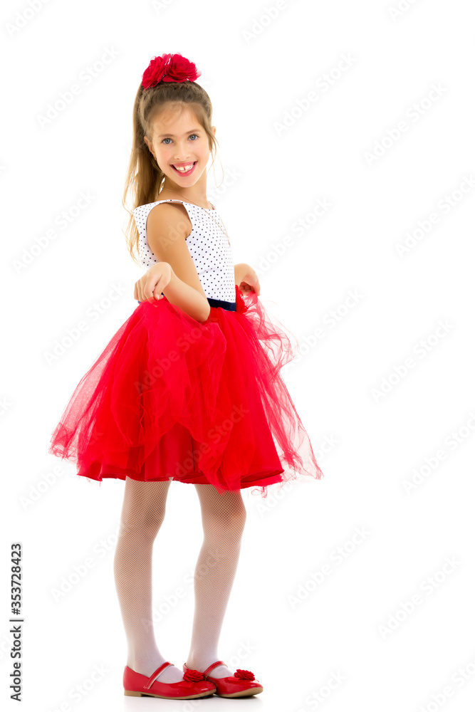 Little girl in an elegant dress.The concept of a happy childhood Little girl in an elegant dress.The concept of a happy childhood