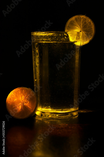 Indian Most Popular Summer Drinks Nimbu Pani Or Nimbo Sarbat,Lemonade in a transparent glass With Black Background. photo