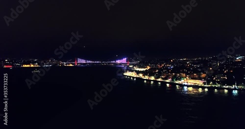 Aerial. Bosphorus Sea Night landscape with the illimunated cable bridge in Istanbul, Turkey
 photo