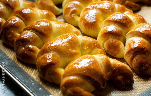 Argentine croissants, medialunas de Manteca over silicon pastry mat background  photo