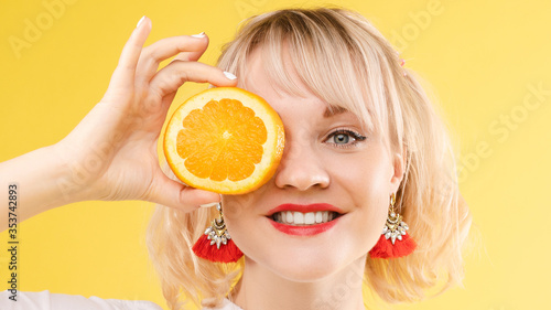 Portrait of a cool cheerful woman girl with oranges. Juice ads. Positive, harmony.
