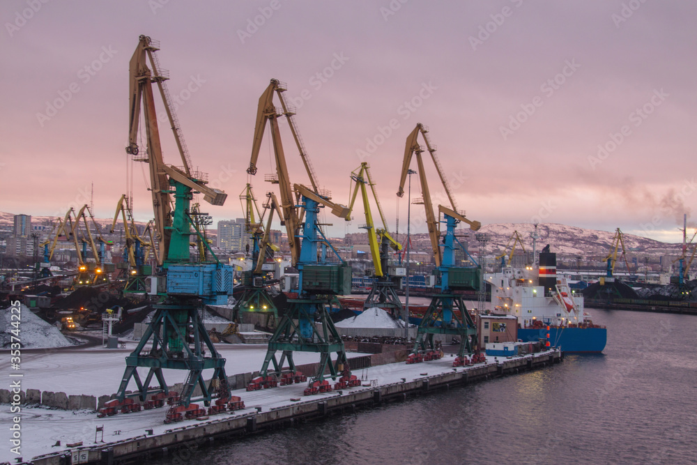 General view of the cargo port. Cargo cranes await the arrival of the vessel for loading unloading coal in the seaport.